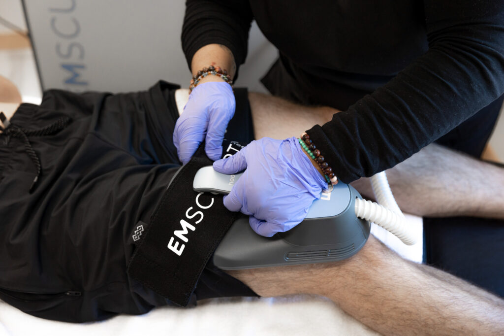 a medical professional with blue gloves performs body contouring on a male patient using semaglutide in Fergus Falls